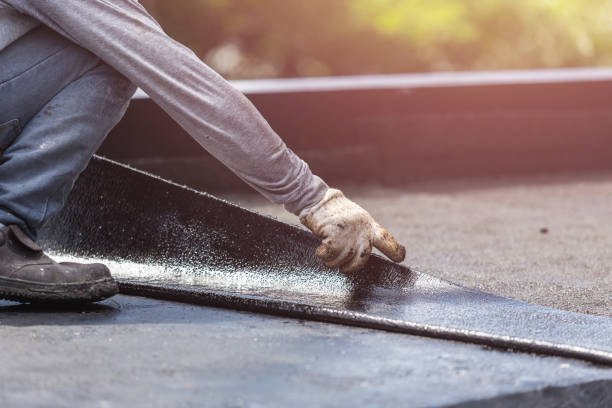 Professional Exterior Waterproofing technician working in Oxford, KS